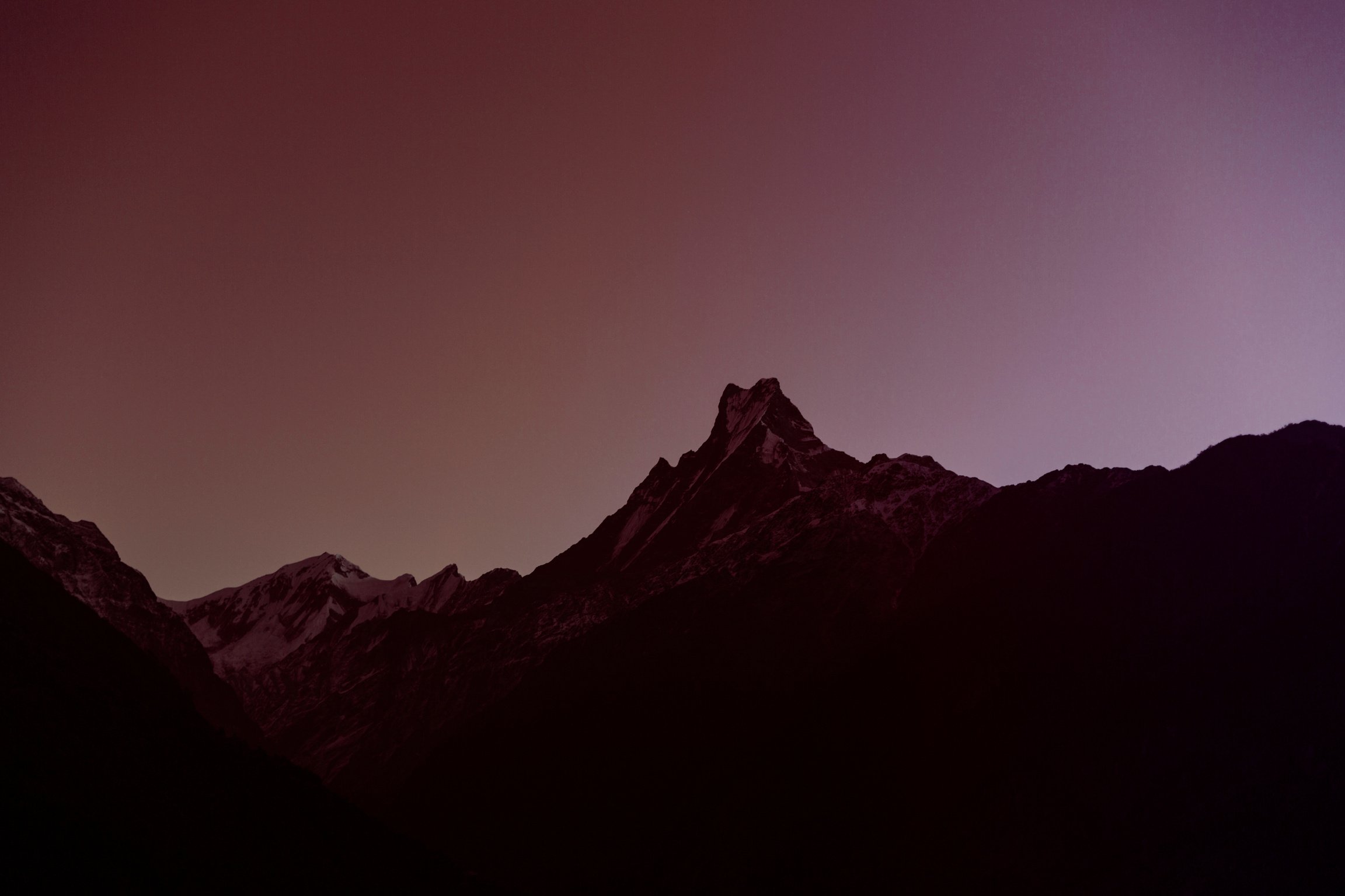 Dark mountains against the background of purple sky